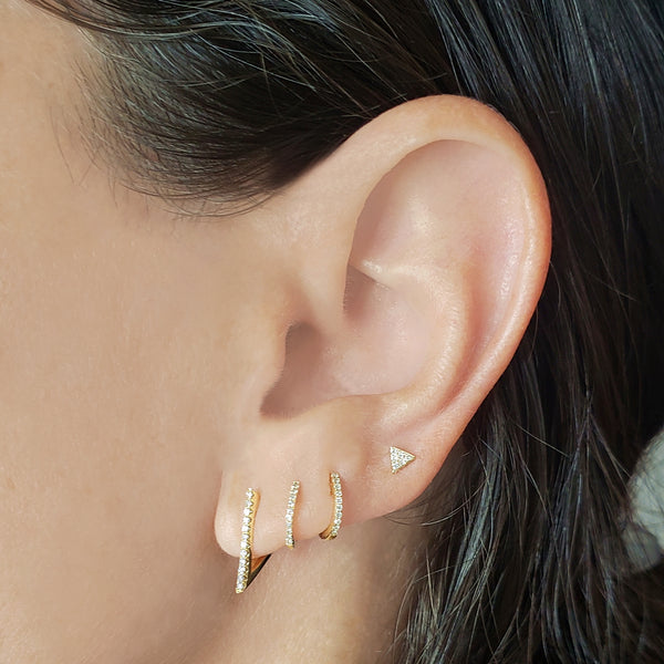 Triangle huggie earrings top
